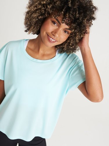 Camiseta deportiva de mujer con espalda abierta transpirable 100% poli